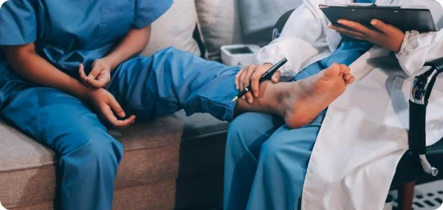 Podiatrist reviewing a treatment plan with a patient